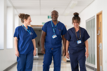Staff walking down a corridor